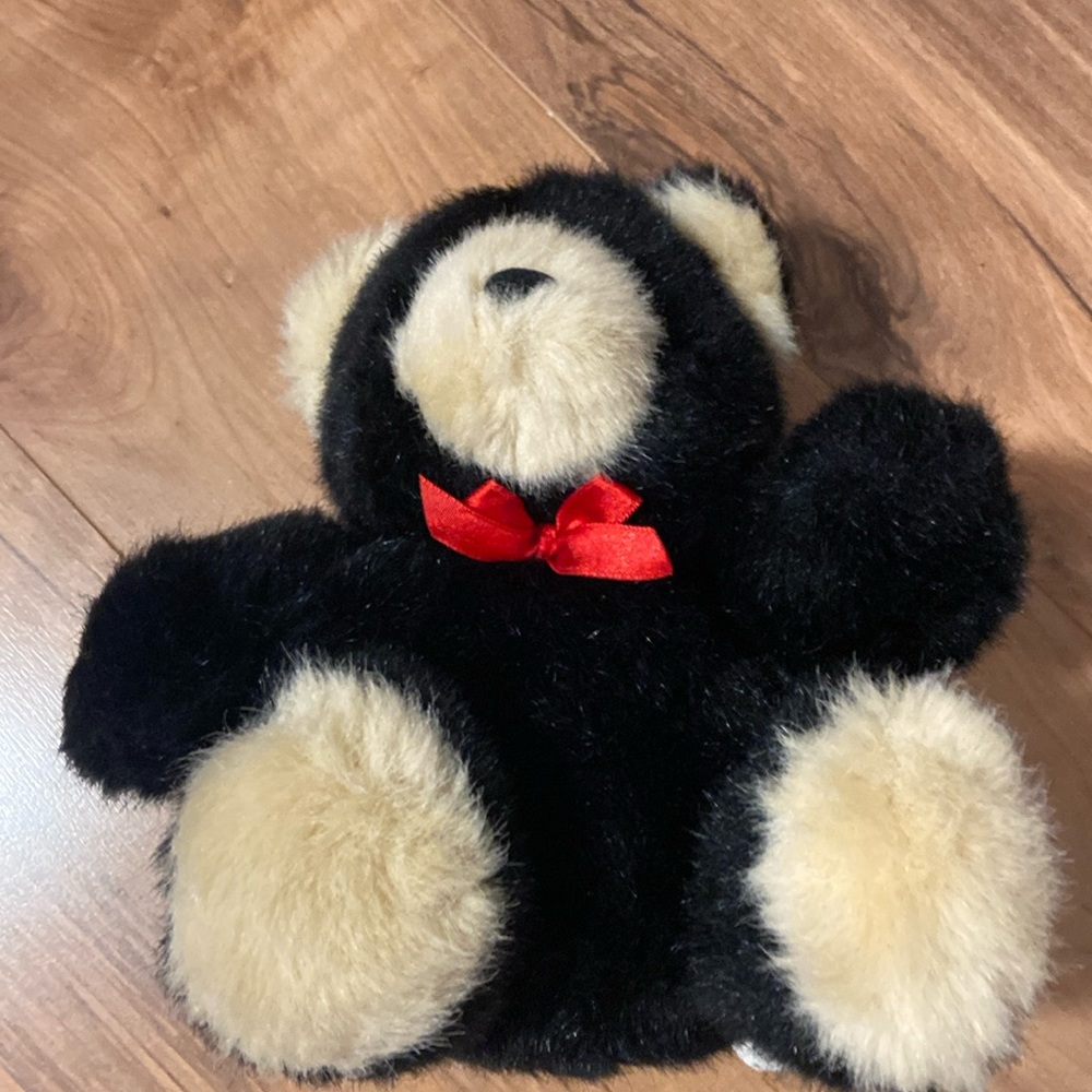 Vintage black and tan teddy bear